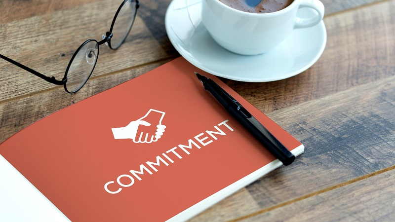 What are the benefits of total commitment, and why is it worthwhile to make the effort?